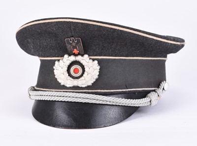 Lot 234 - German Third Reich DRK Officer's visor cap by Peküro