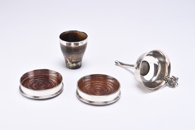 Lot 101 - Two silver mounted coasters, a horn beaker and a plated wine funnel