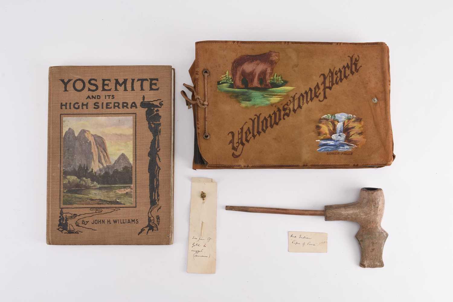 Lot 123 - AMERICAN FRONTIER ITEMS including a yellow metal nugget tie pin, book and photo album (4)