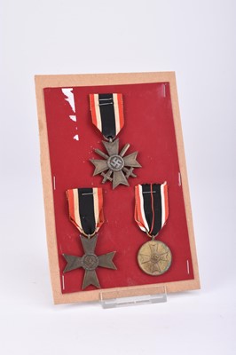 Lot 125 - Germany, Third Reich. War Merit Crosses and one War Merit Medal.