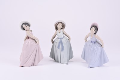 Lot 115 - Three Lladro models of young girls in dresses