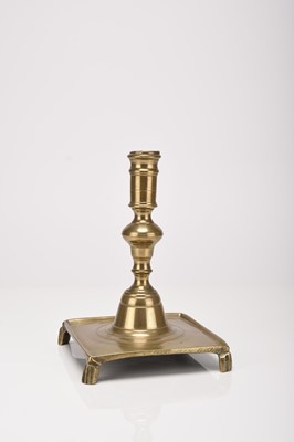 Lot 55 - A Spanish brass candle holder, 17th century