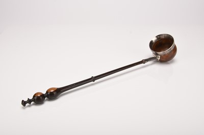 Lot 45 - A 17th century mulberry and lignum vitae toddy ladle