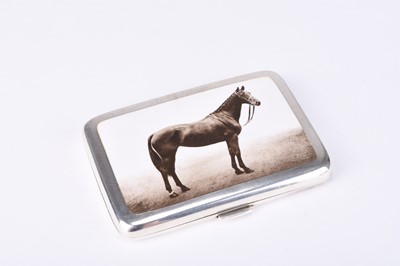 Lot 58 - An early 20th century silver and enamel cigarette case depicting a horse