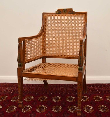 Lot 55 - A 19th century caned and painted satinwood armchair