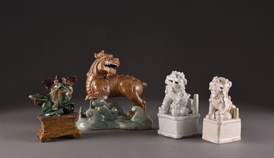 Lot 146 - A group of four Chinese figures of lion dogs