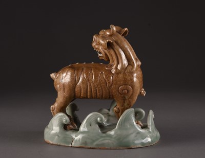 Lot 146 - A group of four Chinese figures of lion dogs