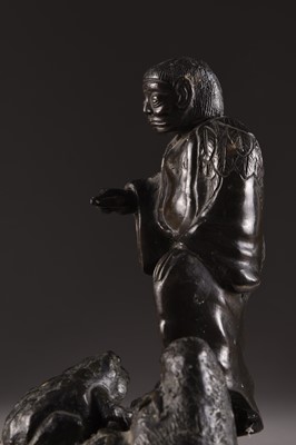 Lot 203 - A Japanese bronze figure of an oni with a toad, Meiji era