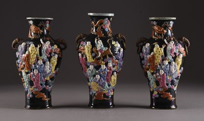 Lot 144 - Three Chinese famille rose relief moulded vases, Qianlong marks but later
