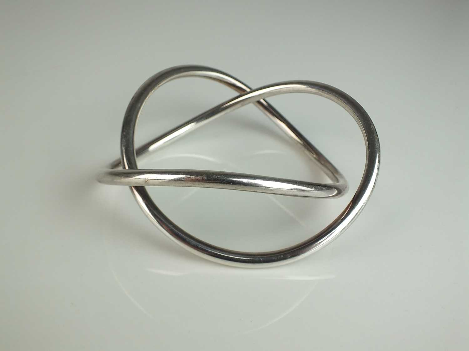Lot 307 - A George Jensen silver ‘Swing’ bracelet/bangle