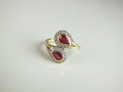 Lot 125 - A 9ct gold ruby and diamond double pear cluster ring