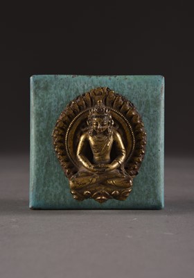 Lot 154 - A Nepalese gilt copper repoussé crowned Buddha, 17th Century