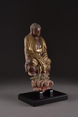 Lot 3 - A Chinese painted and parcel gilt pottery Buddha plaque, Yuan or early Ming