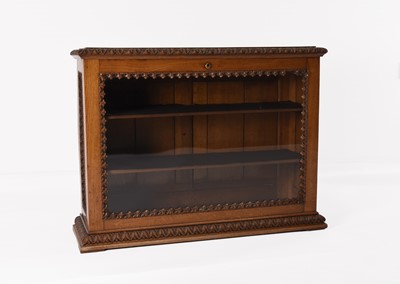Lot 379 - A carved walnut glazed counter-top display cabinet