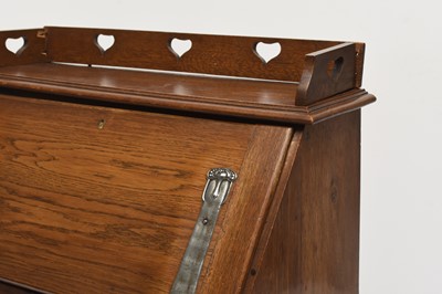 Lot 117 - An Art Nouveau style oak bureau desk