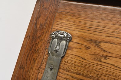 Lot 117 - An Art Nouveau style oak bureau desk