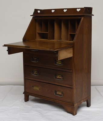 Lot 117 - An Art Nouveau style oak bureau desk