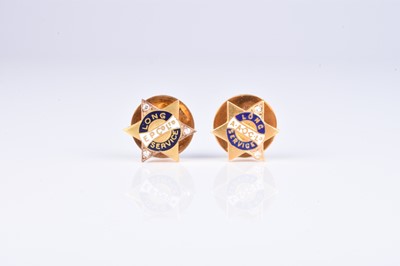 Lot 140 - Two early 20th century diamond and enamel long service studs
