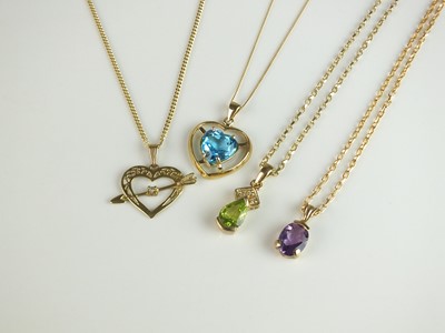 Lot 206 - A collection of four 9ct gold pendants on chains