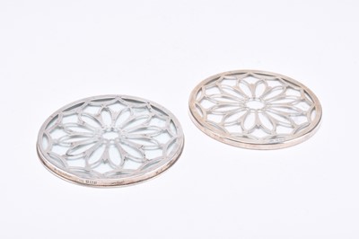 Lot 79 - A matched pair of silver mounted glass coasters