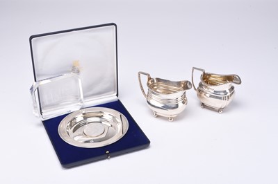 Lot 74 - A cased silver commemorative Alms dish and two silver cream jugs