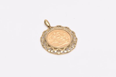 Lot 290 - Edward VII sovereign dated 1910 within decorative 9ct gold pendant mount