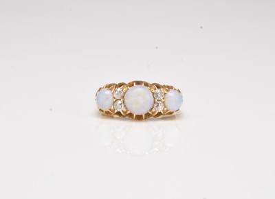 Lot 220 - An 18ct gold Victorian opal and diamond ring