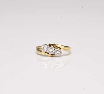 Lot 220 - An 18ct gold three stone diamond ring