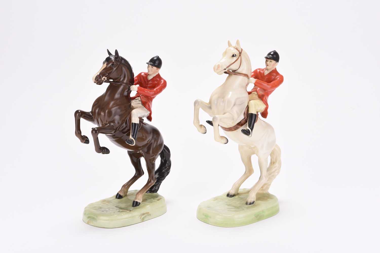 Lot 21 - A pair of Beswick Huntsmen on rearing horses, model 868