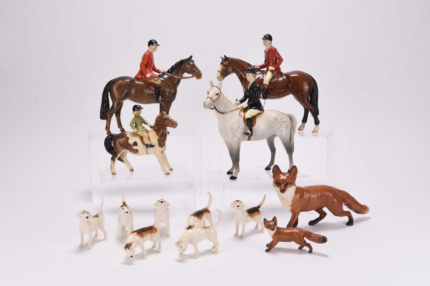 Lot 23 - A Beswick Hunting set including riders, foxes and hounds