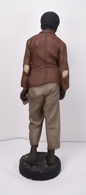 Lot 24 - Life size polychrome plaster figure of a young black boy