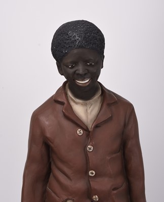 Lot 24 - Life size polychrome plaster figure of a young black boy