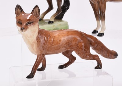 Lot 22 - A Beswick hunting set including riders, foxes and hounds