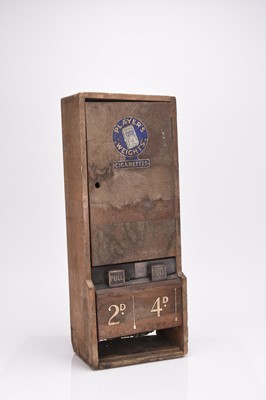 Lot 92 - A vintage Player's coin operated cigarette dispenser