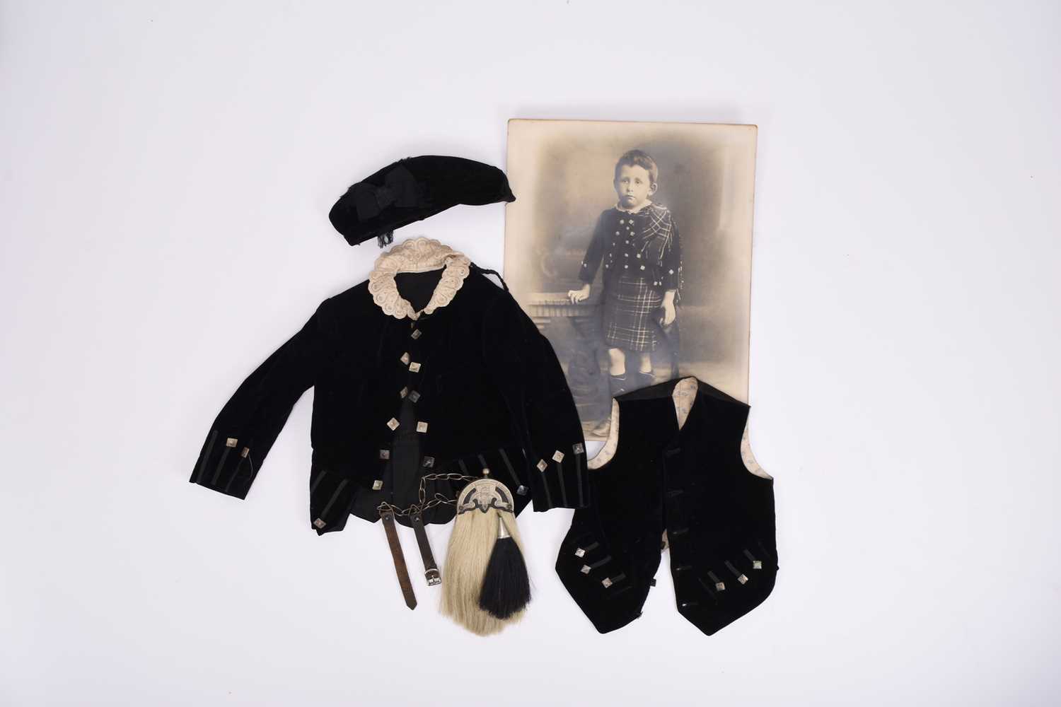 Lot 230 - A Victorian child's black velvet jacket and waistcoat