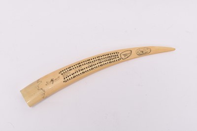 Lot 83 - A late 19th century walrus tusk cribbage board