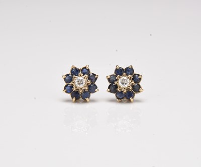 Lot 235 - A pair of 9ct gold sapphire and diamond floral cluster earrings