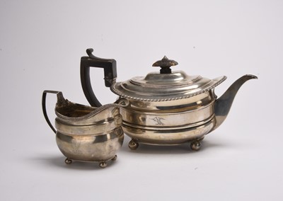 Lot 33 - A George III silver teapot and cream jug