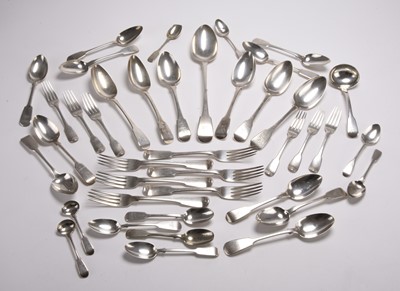 Lot 132 - A matched set of George III silver Fiddle pattern flatware