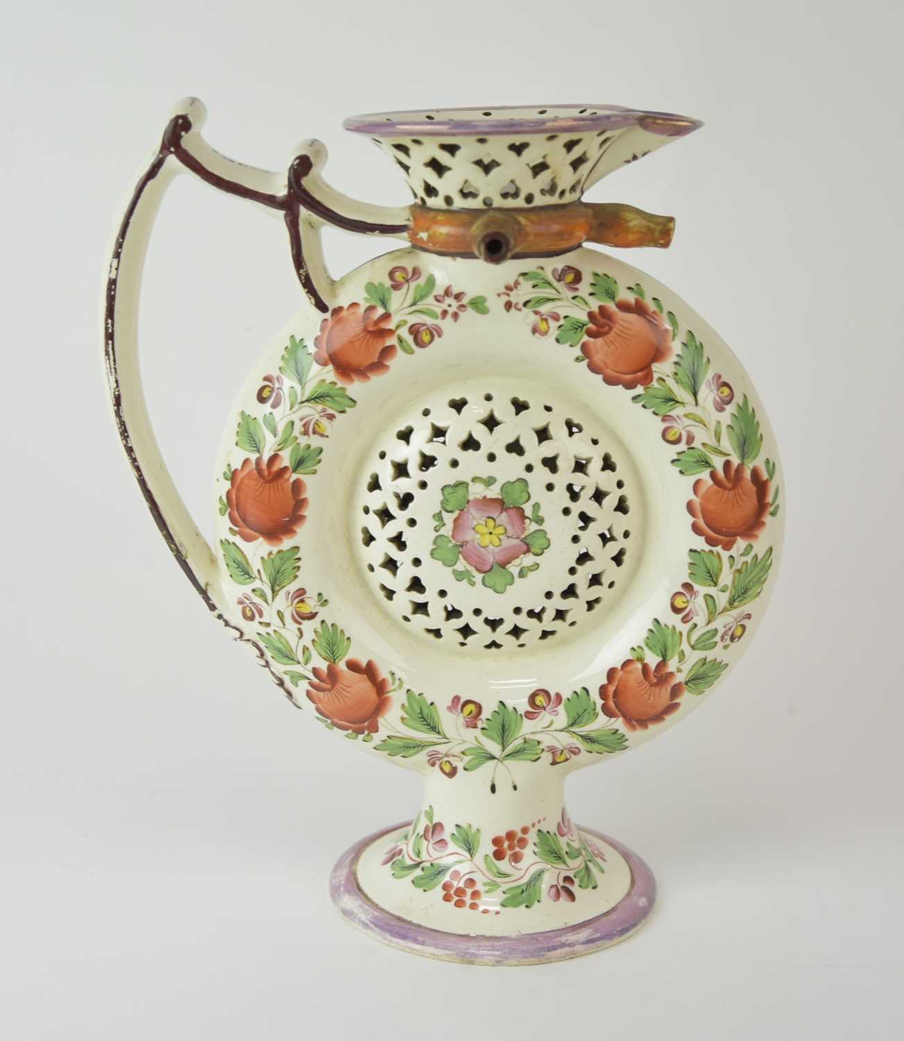 Lot 98 - An English pearlware puzzle jug, probably Leeds, circa 1800