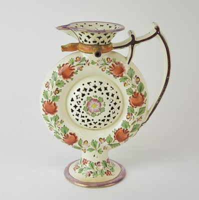Lot 98 - An English pearlware puzzle jug, probably Leeds, circa 1800