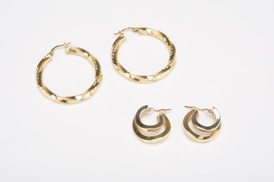Lot 247 - Two pairs of yellow metal hoop earrings