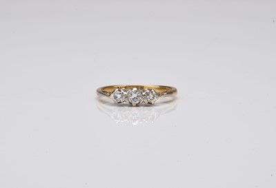 Lot 339 - An 18ct gold graduated three stone diamond ring