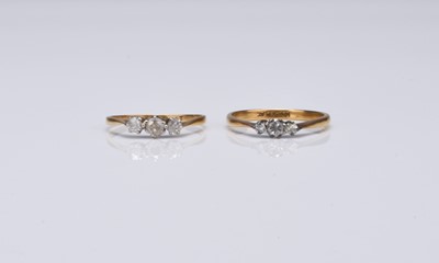 Lot 155 - Two graduated three stone diamond rings