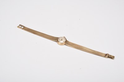 Lot 399 - Omega: A lady's 9ct gold bracelet watch, together with a Gucci wristwatch