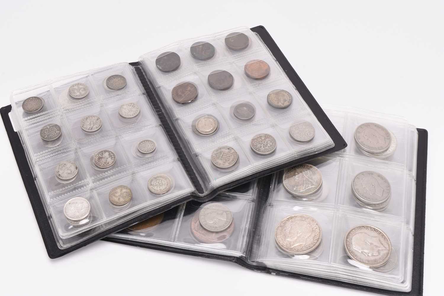 Lot 325 - Two coin collection books and other coinage