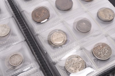 Lot 325 - Two coin collection books and other coinage
