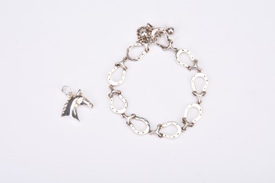 Lot 146 - A Rosemary Hetherington silver horseshoe bracelet and charm