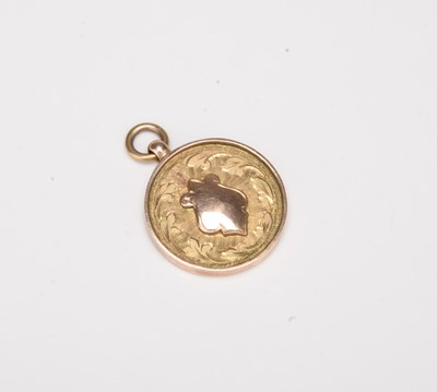 Lot 234 - A 9ct gold shield fob medallion