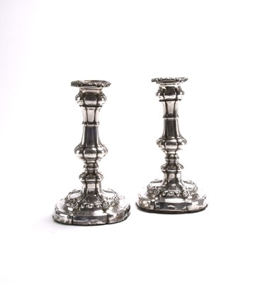 Lot 114 - A pair of George III silver mounted candlesticks